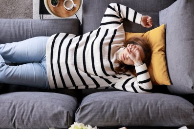 Woman Attempts to Take Nap on Couch, 'Headbutter' Pet Has Other Ideas