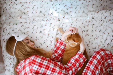 Orange Cat Who Loves Naps Attached to Owner Leaves Internet in Serious Envy